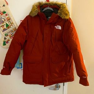 The North Face McMurdo Men’s Parka in Brick Red.